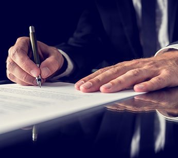 Kelowna mortgage broker - John Antle - signing documents