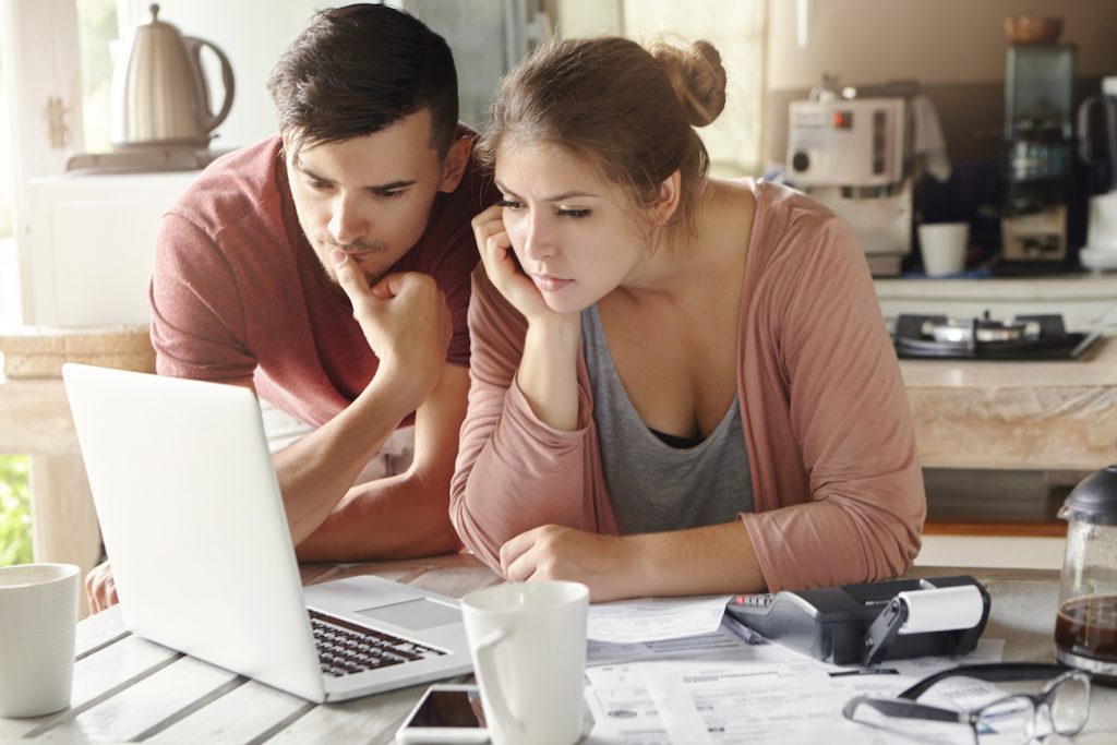 kelowna mortgage broker Kelowna couple reviews mortgage insurance trying to determine if it is required